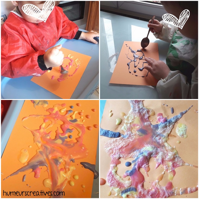 les enfants utilisent la peinture gonflante (puff paint)