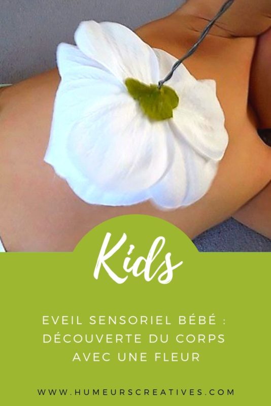 Eveil sensoriel bébé : découverte du corps avec une fleur