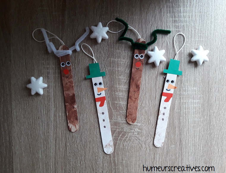 suspension de Noël réalisées avec des batonnets en bois par les enfants : bonhomme de neige et renne